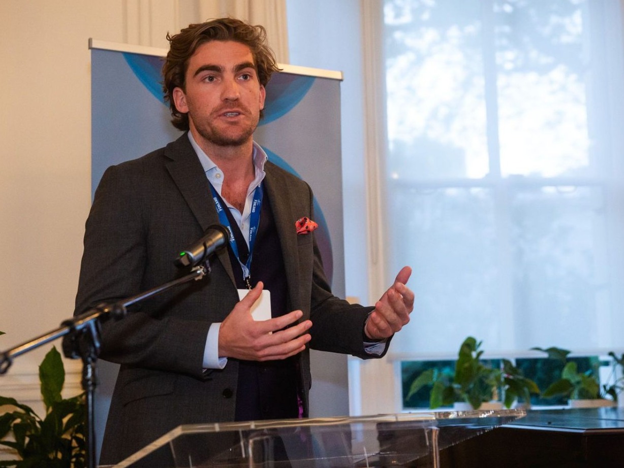 Charlie Olpin speaking at an industry event